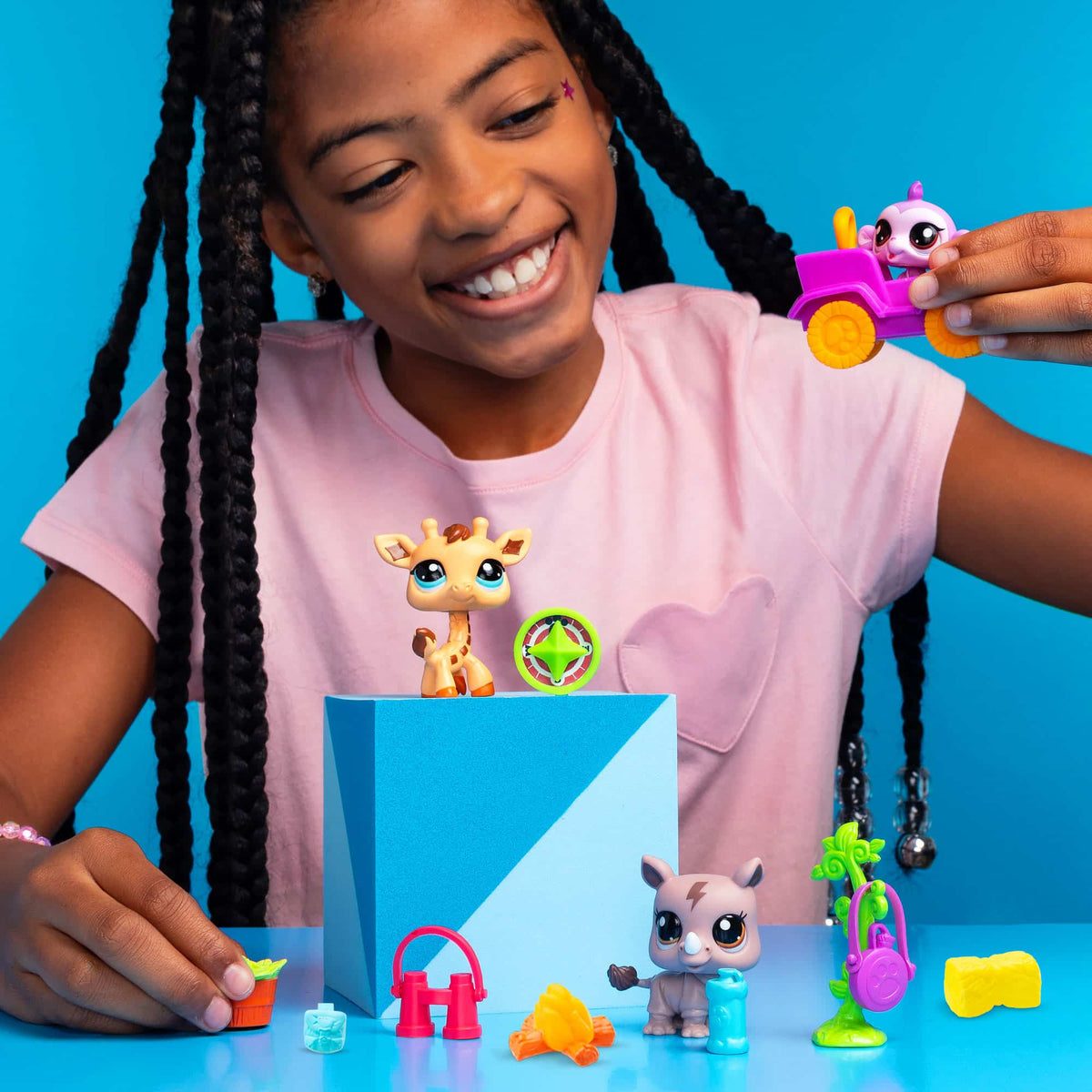 Littlest Pet Shop - Safari Play Pack - Lifestyle shot of girl playing with the Monkey in a pink car